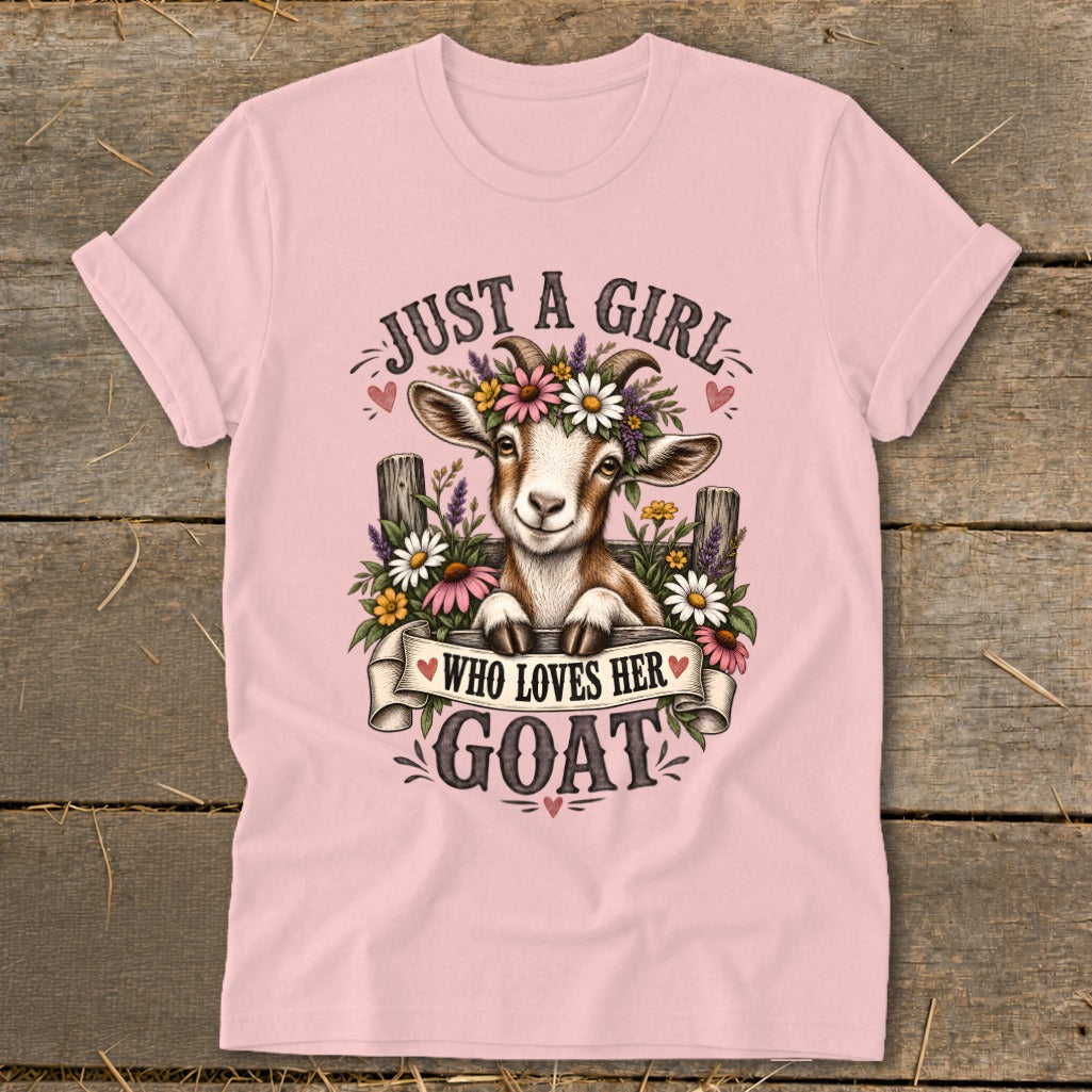 Pink t-shirt with a graphic of a goat wearing flowers, text says "JUST A GIRL WHO LOVES HER GOAT".