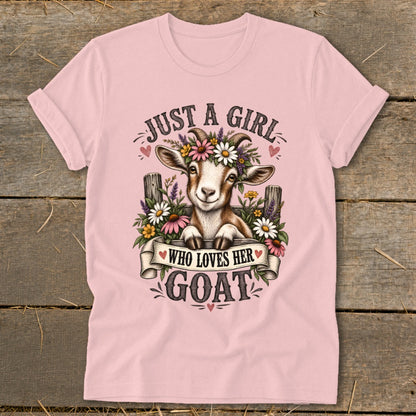 Pink t-shirt with a graphic of a goat wearing flowers, text says "JUST A GIRL WHO LOVES HER GOAT".