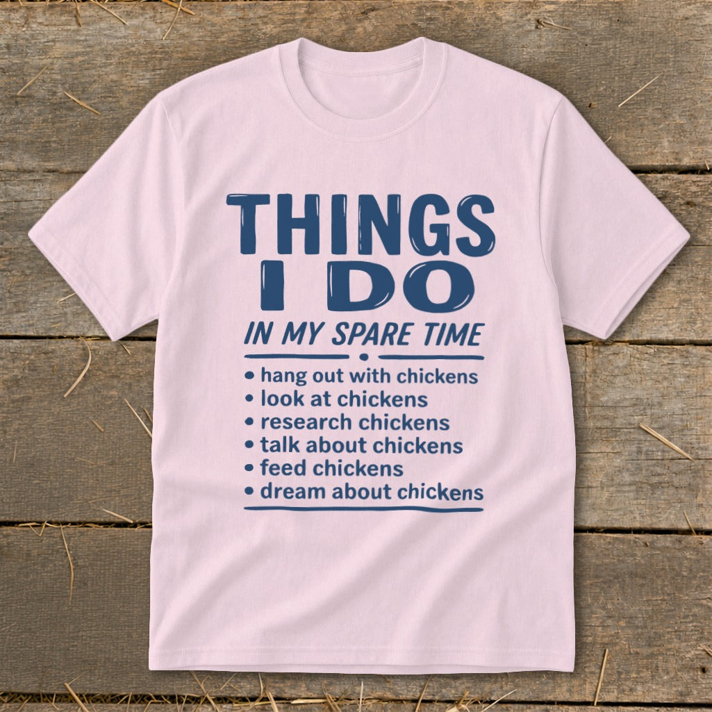 Light pink t-shirt with blue text about activities involving chickens.