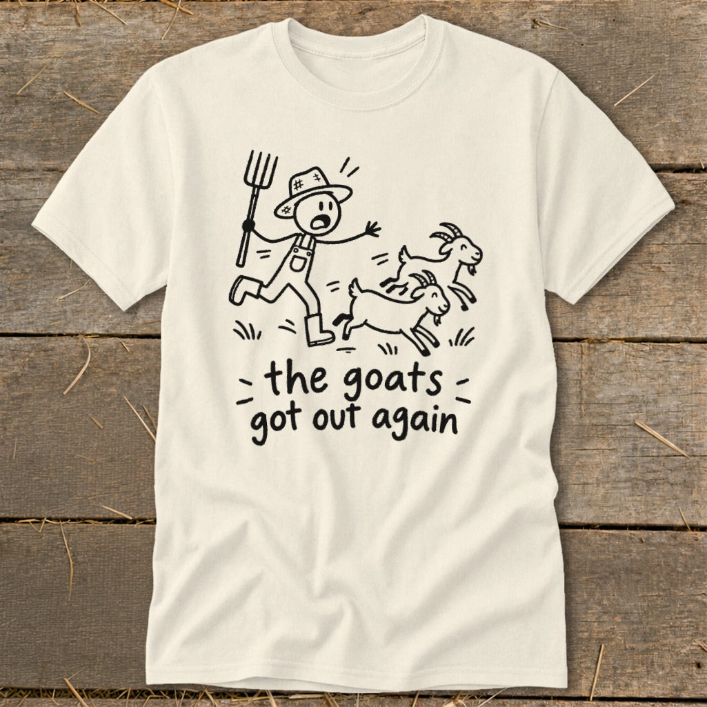 Cream t-shirt with stick figure farmer chasing goats, text reads "the goats got out again".