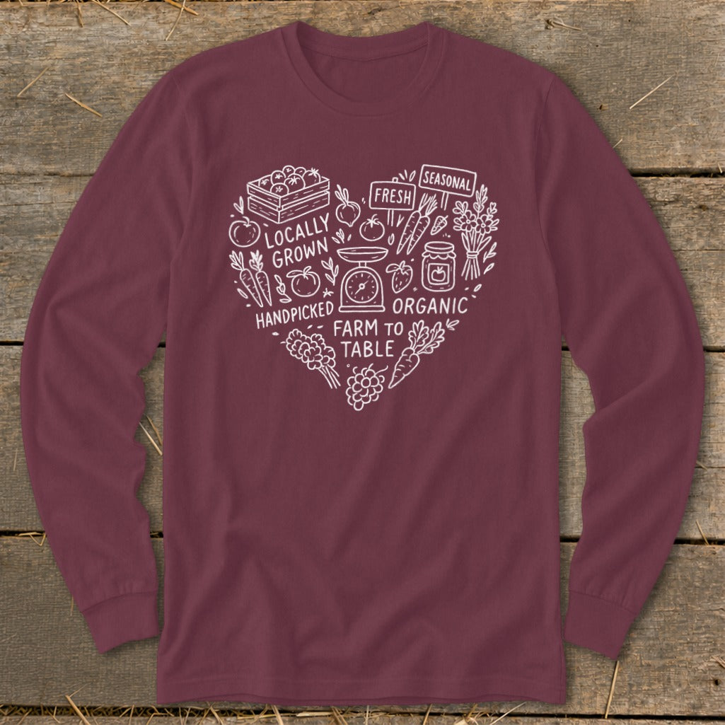 Maroon long sleeve shirt with white heart graphic of produce, jars, and text about local and organic food.