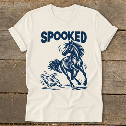 Cream t-shirt with a dark blue graphic of a spooked horse and ghost.