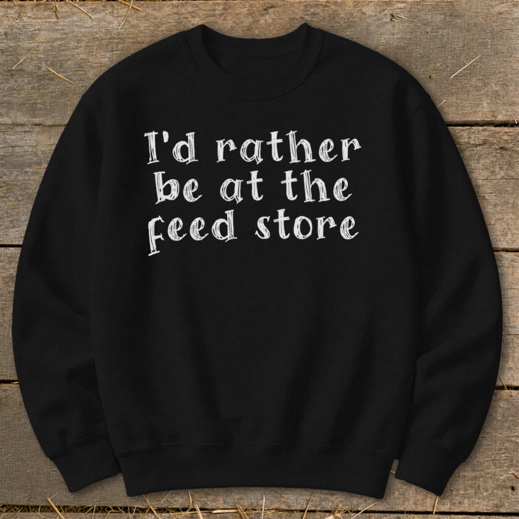 Black sweatshirt with white text that says "I'd rather be at the feed store."