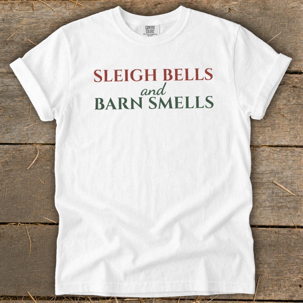 White Comfort Colors t-shirt with text "Sleigh Bells and Barn Smells".