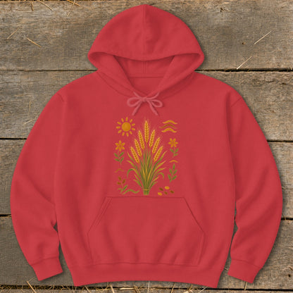 Red hoodie with a central illustration of wheat stalks, sun, and flowers.