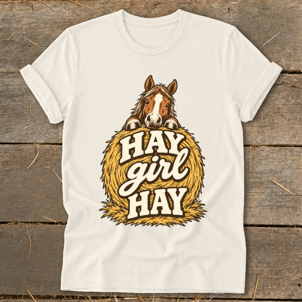 Horse peeking over hay bale with "HAY girl HAY" text.