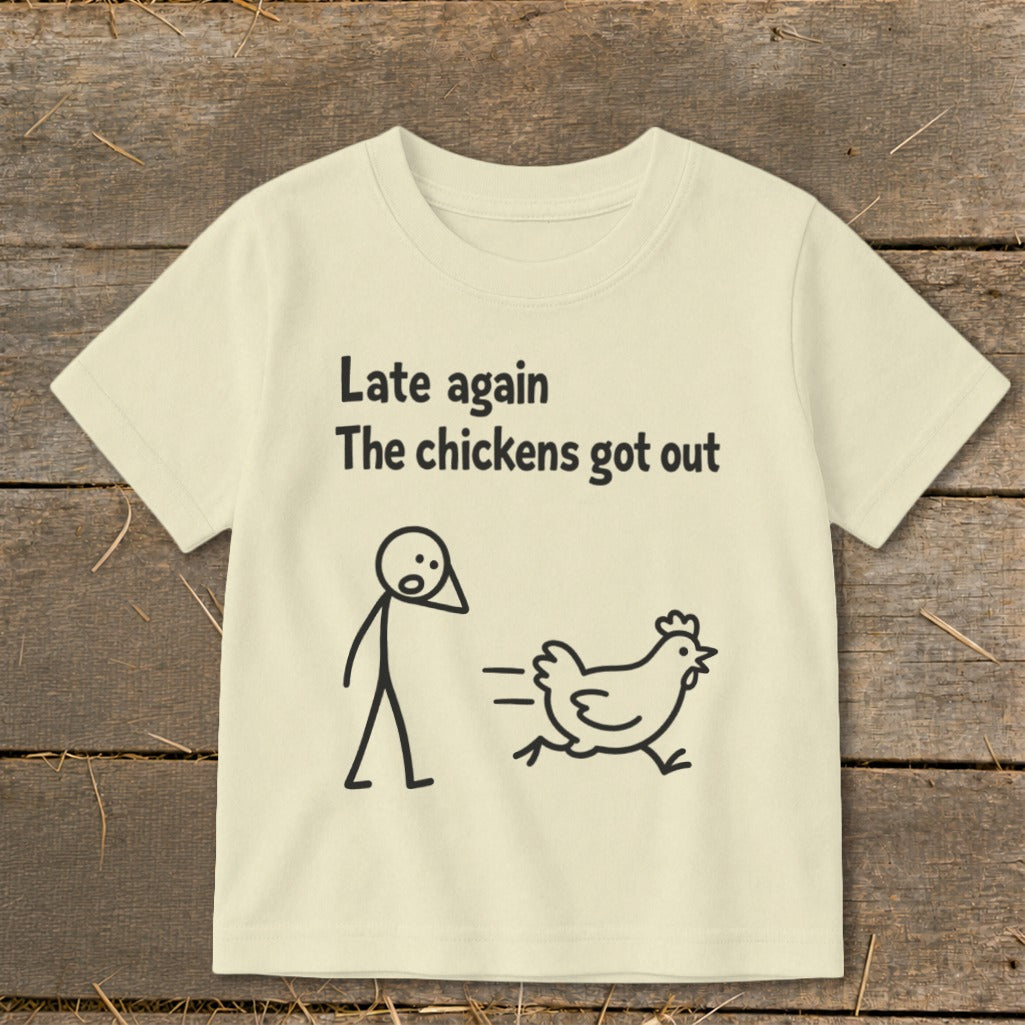 Cream t-shirt with text "Late again The chickens got out" and stick figures.