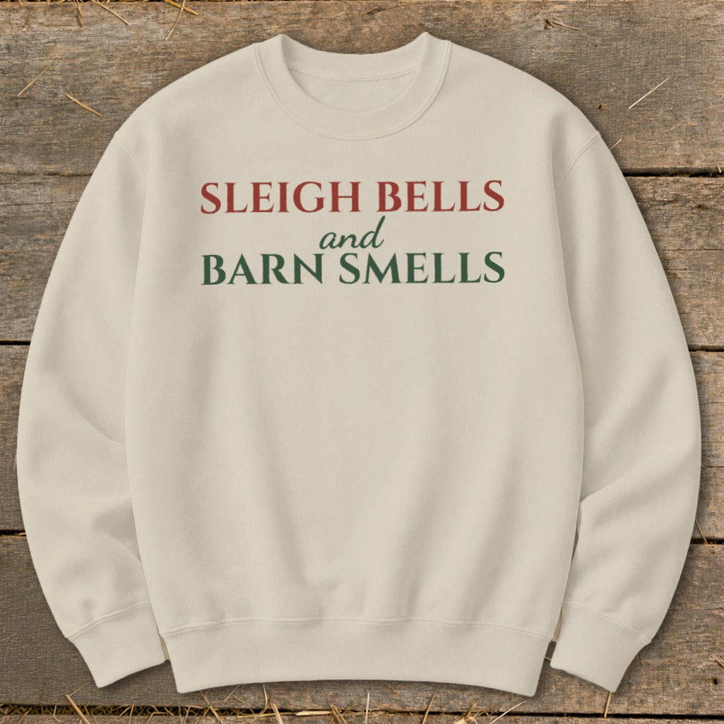 Cream sweatshirt with red and green text reading "Sleigh Bells and Barn Smells".