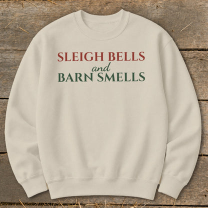 Cream sweatshirt with red and green text reading "Sleigh Bells and Barn Smells".