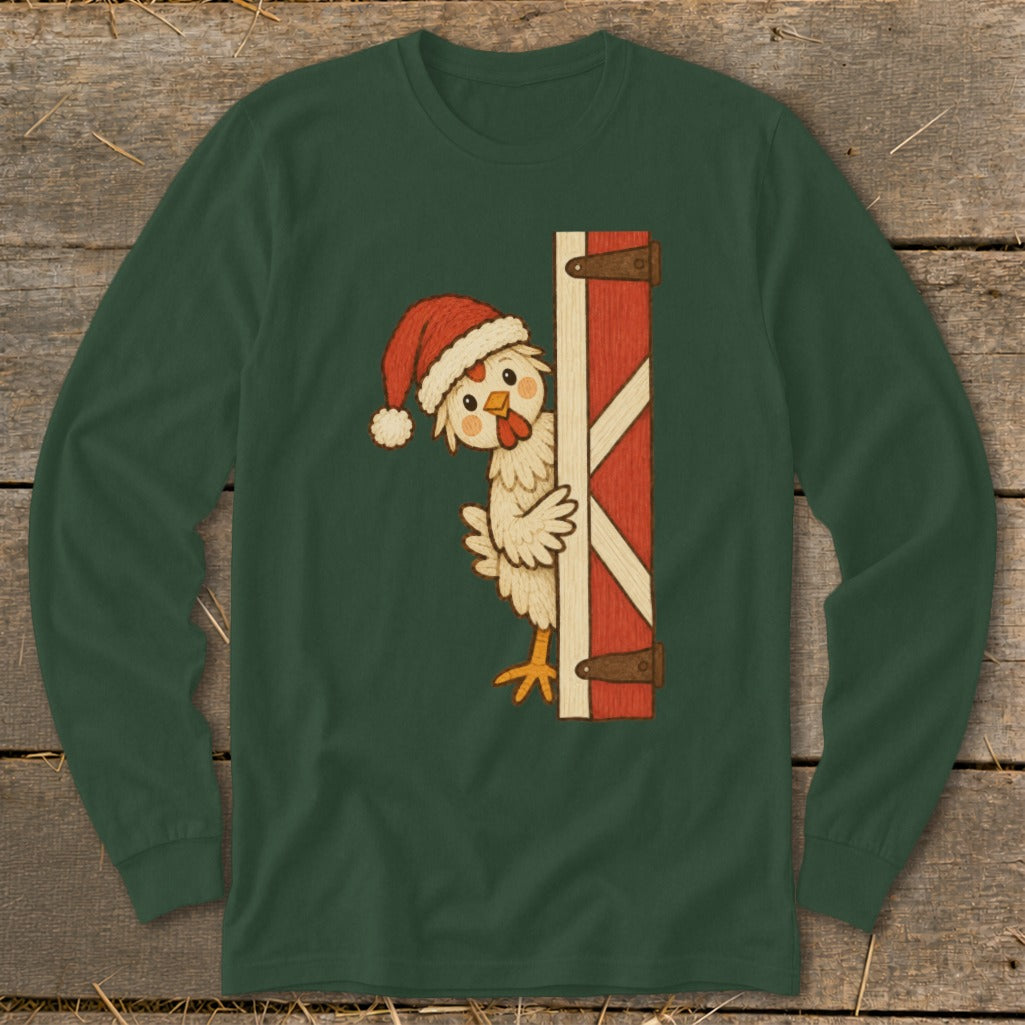 Green long sleeve shirt with a cartoon chicken wearing a Santa hat peeking from behind a barn door.