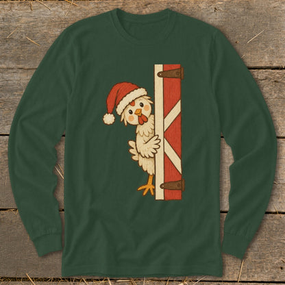 Green long sleeve shirt with a cartoon chicken wearing a Santa hat peeking from behind a barn door.