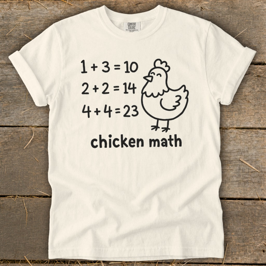 Cream t-shirt with "chicken math" and silly math equations with a chicken graphic.
