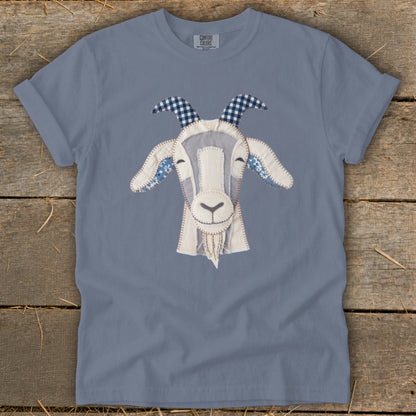 Gray t-shirt with a fabric applique of a goat's head.