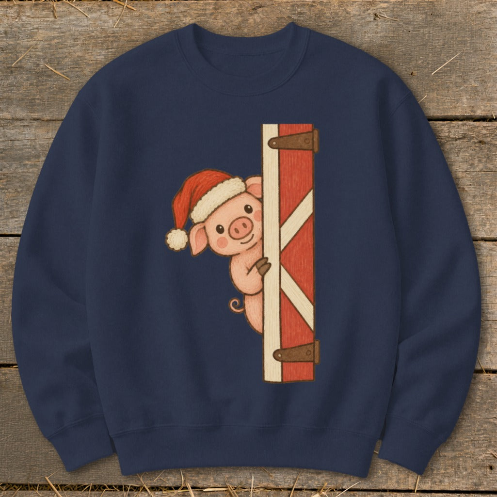 Pig wearing a Santa hat peeking from behind a red barn door.