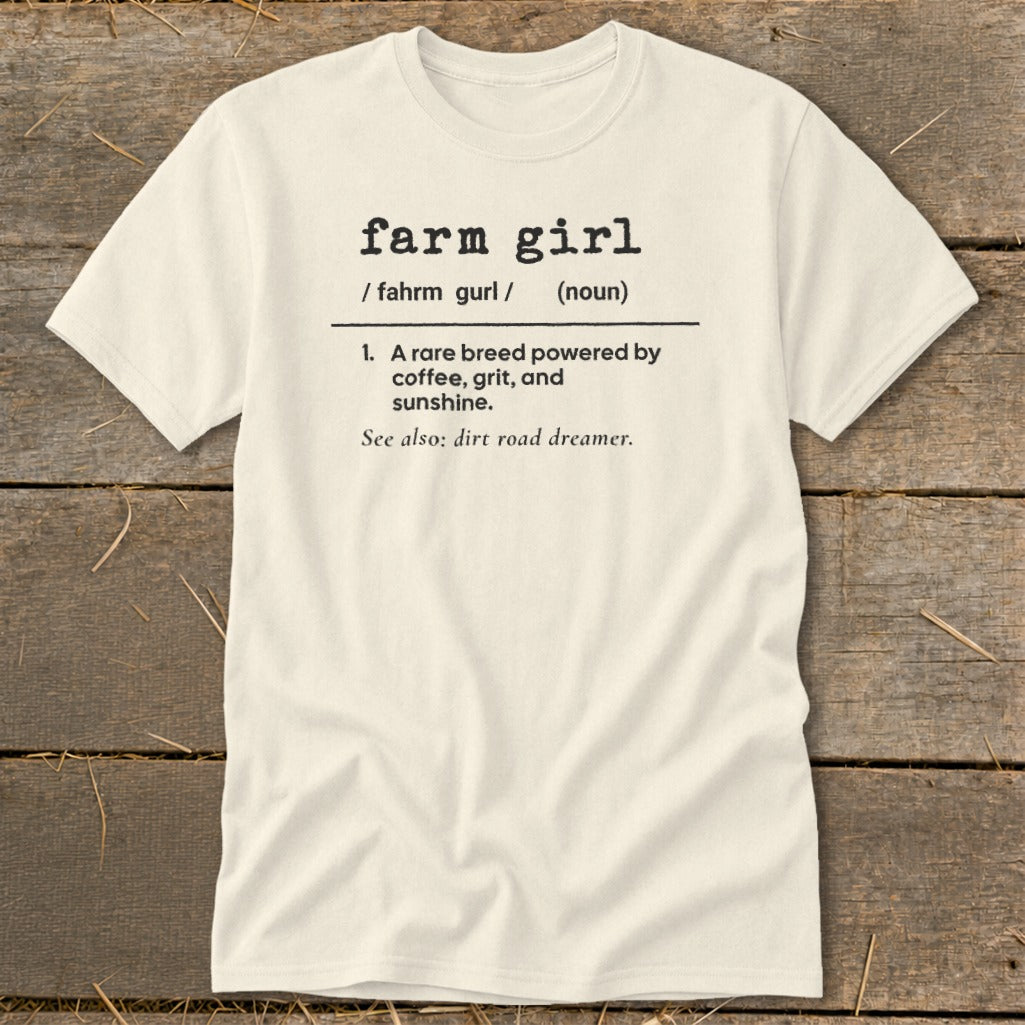 Cream t-shirt with "farm girl" definition: "A rare breed powered by coffee, grit, and sunshine."