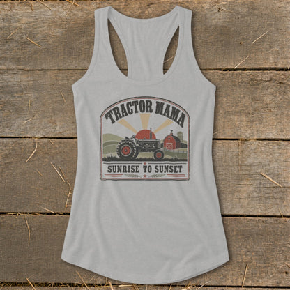 A light gray women's racerback tank top featuring a vintage tractor graphic and the text Tractor Mama Sunrise to Sunset.
