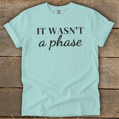Pale blue t-shirt with black text "IT WASN'T a phase"