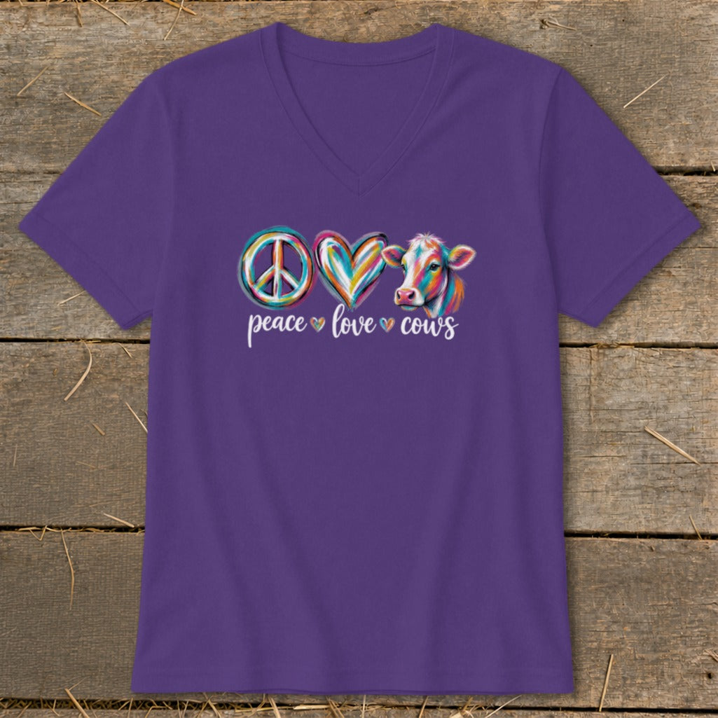 Purple t-shirt with peace sign, heart, and cow art and text "peace love cows".