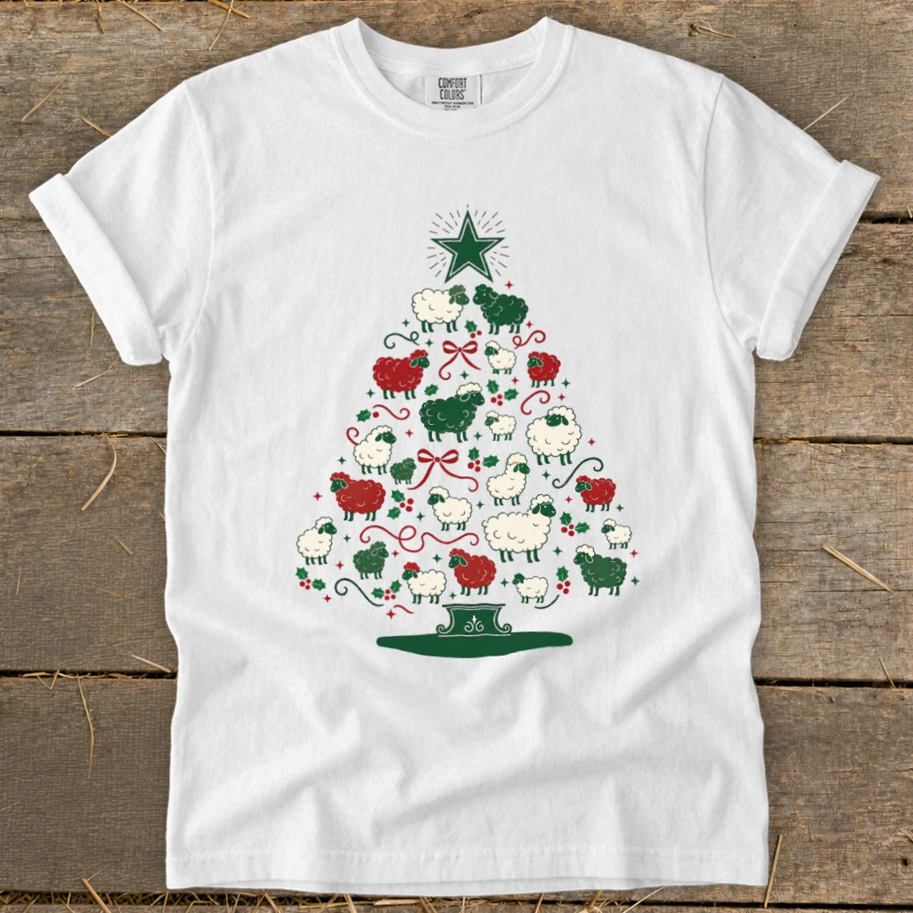 White t-shirt with Christmas tree graphic made of red, green, and white sheep.