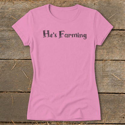 Pink t-shirt with "He's Farming" text in a distressed font.
