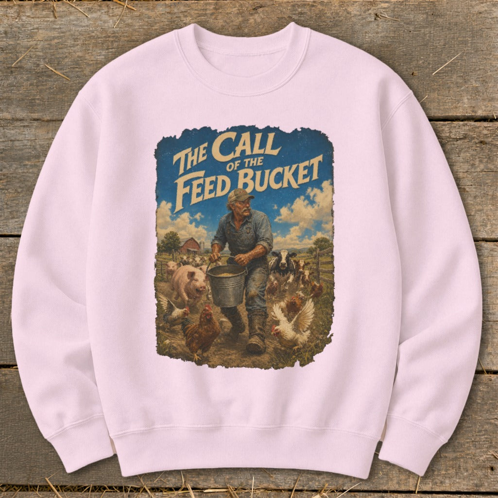 "The Call of the Feed Bucket" graphic on a pink sweatshirt with farm animals.