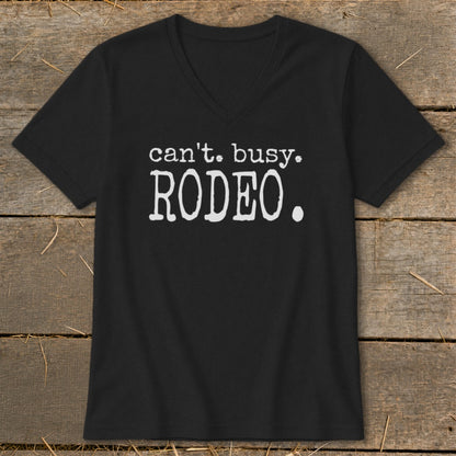 Black v-neck t-shirt with white text: "can't. busy. RODEO."