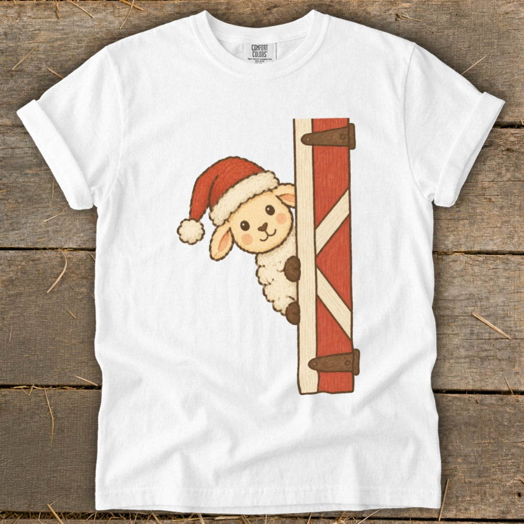 Cute sheep in a Santa hat peeking from a red barn door.