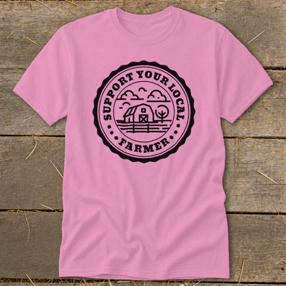 Pink t-shirt with black circular graphic: "SUPPORT YOUR LOCAL FARMER" and a barn scene.