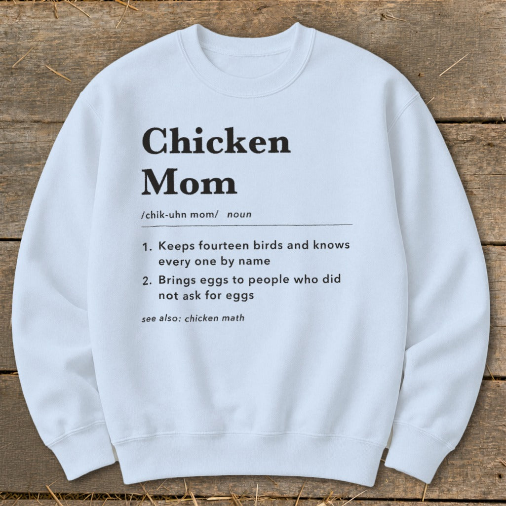 White sweatshirt with "Chicken Mom" definition printed in black text.