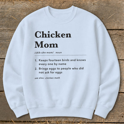 White sweatshirt with "Chicken Mom" definition printed in black text.