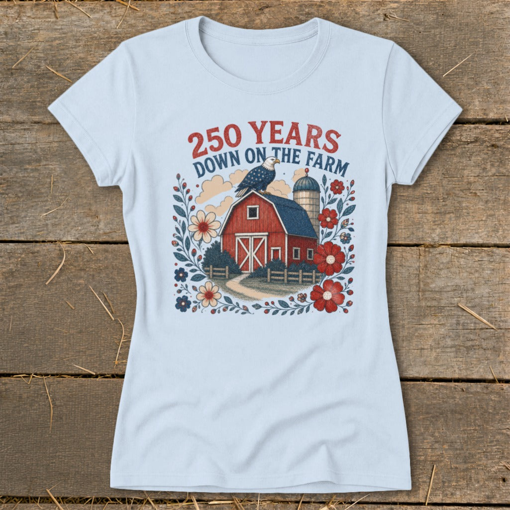 Light blue t-shirt with a barn, silo, eagle, and flowers graphic and text "250 YEARS DOWN ON THE FARM."