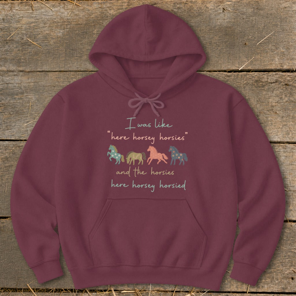 Maroon hoodie with text and four illustrated horses.