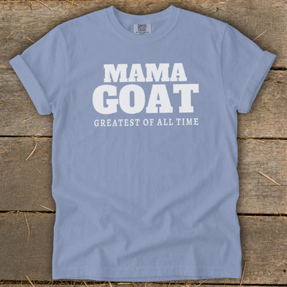 Light blue t-shirt with white text "MAMA GOAT GREATEST OF ALL TIME".