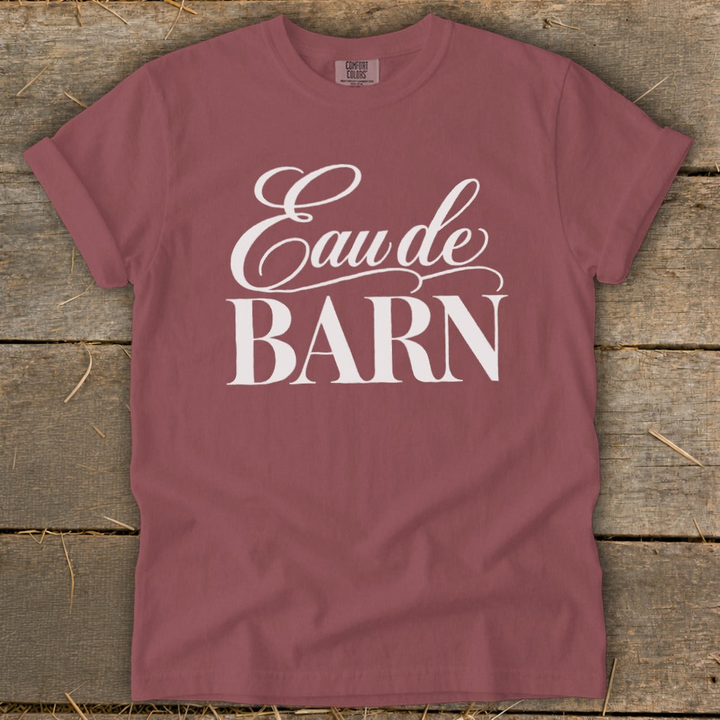 Mauve t-shirt with "Eau de BARN" printed in white script and block letters.