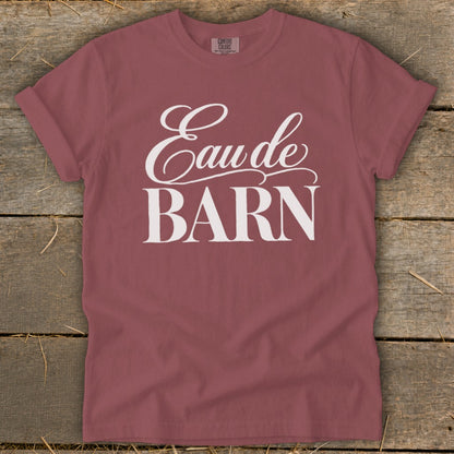 Mauve t-shirt with "Eau de BARN" printed in white script and block letters.
