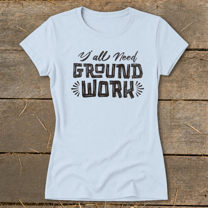 Light blue t-shirt with "Y'all Need GROUND WORK" text printed in black.