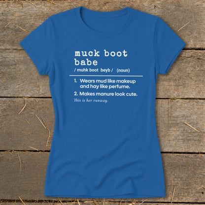 Blue t-shirt with "muck boot babe" definition: "Wears mud like makeup and hay like perfume. Makes manure look cute. This is her runway."
