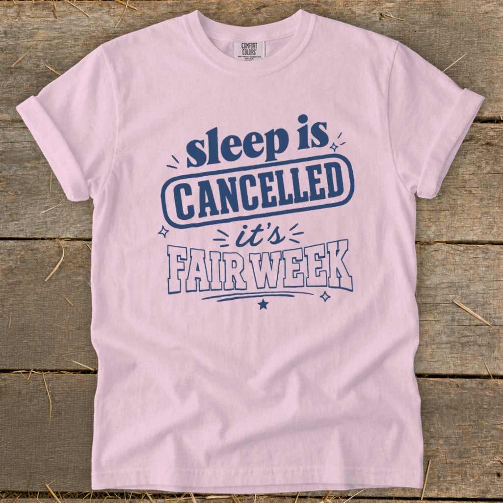 Pink t-shirt with navy blue text reading "sleep is CANCELLED it's FAIR WEEK".