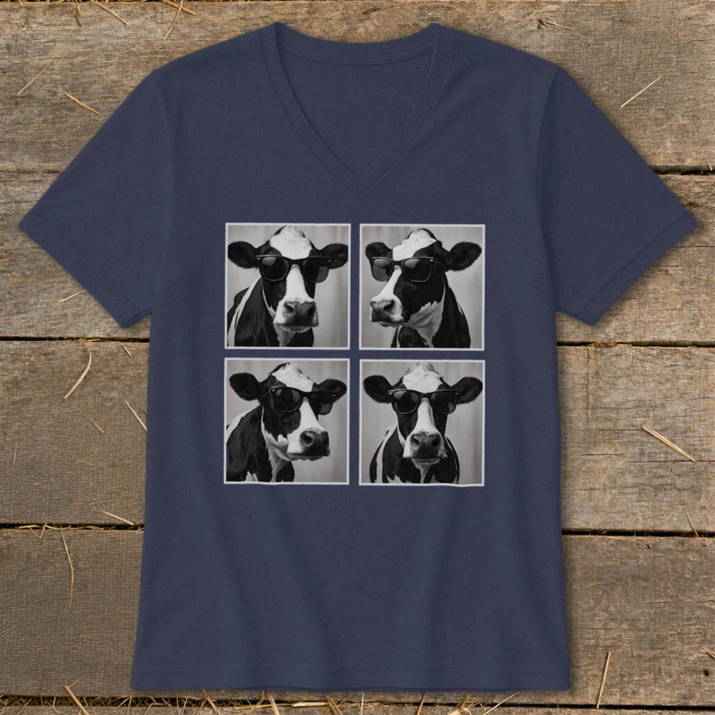 Four black and white cow portraits wearing sunglasses, arranged in a grid on a navy v-neck t-shirt.