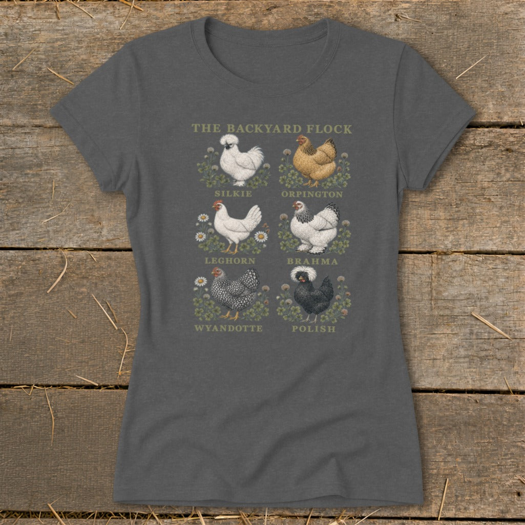 Gray t-shirt featuring illustrations of six chicken breeds with their names below: Silkies, Orpingtons, Leghorns, Brahmas, Wyandottes, and Polish.