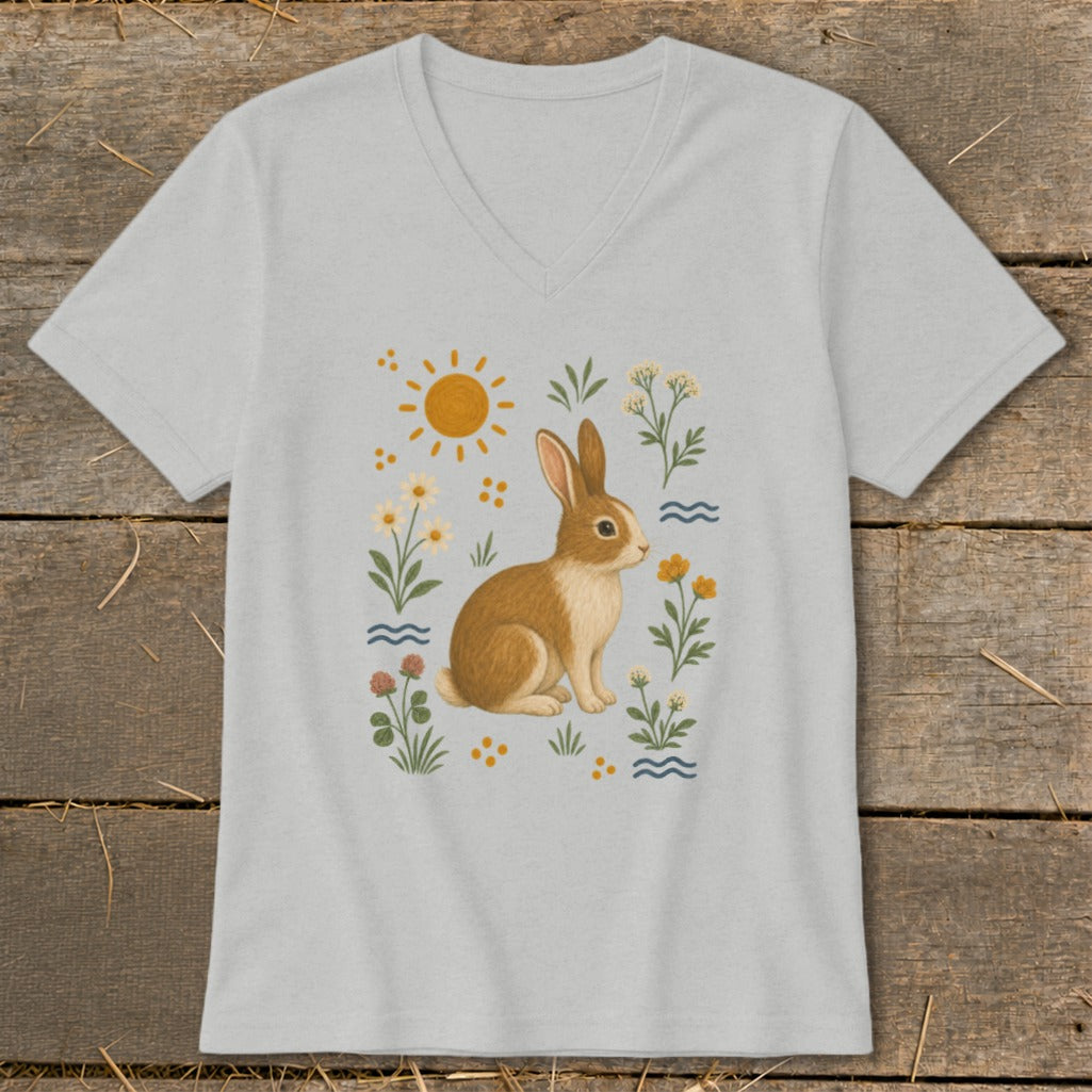 Light gray t-shirt featuring a watercolor illustration of a rabbit surrounded by flowers and the sun.
