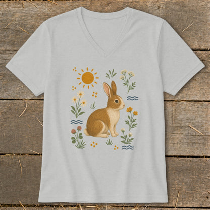 Light gray t-shirt featuring a watercolor illustration of a rabbit surrounded by flowers and the sun.