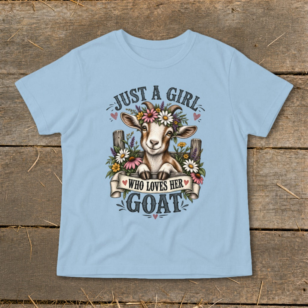 Light blue t-shirt with a drawing of a goat wearing a flower crown and the text "Just a girl who loves her goat."
