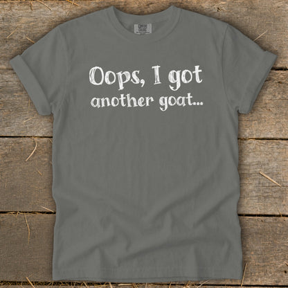 Gray t-shirt with white text that says "Oops, I got another goat..."
