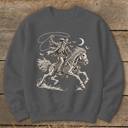 Skeleton cowboy on a skeleton horse with lasso under a crescent moon.