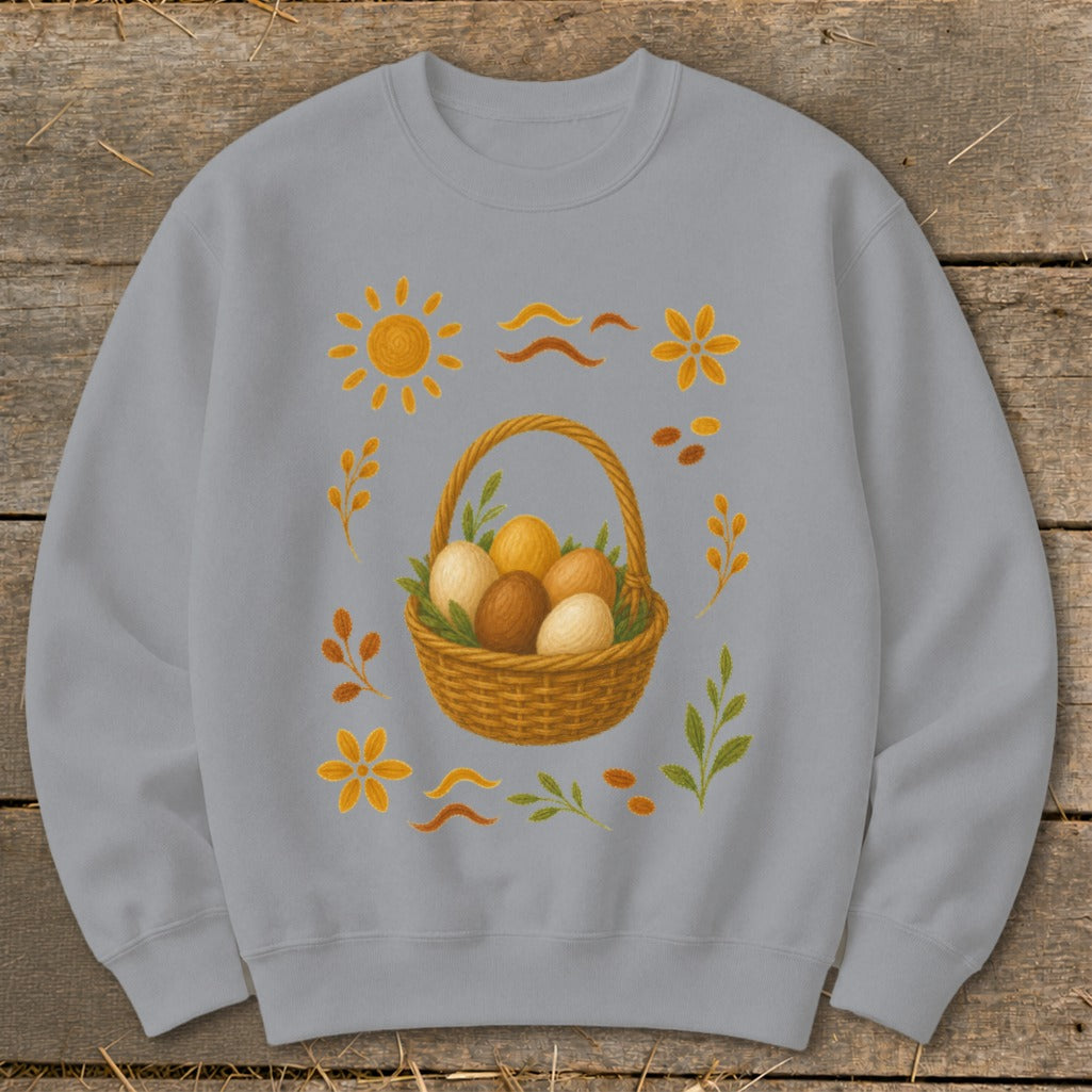 Light gray sweatshirt with a central woven basket of Easter eggs and surrounding decorative elements.
