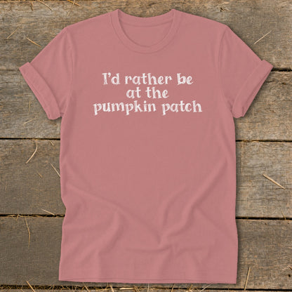Pink t-shirt with white text reading "I'd rather be at the pumpkin patch."