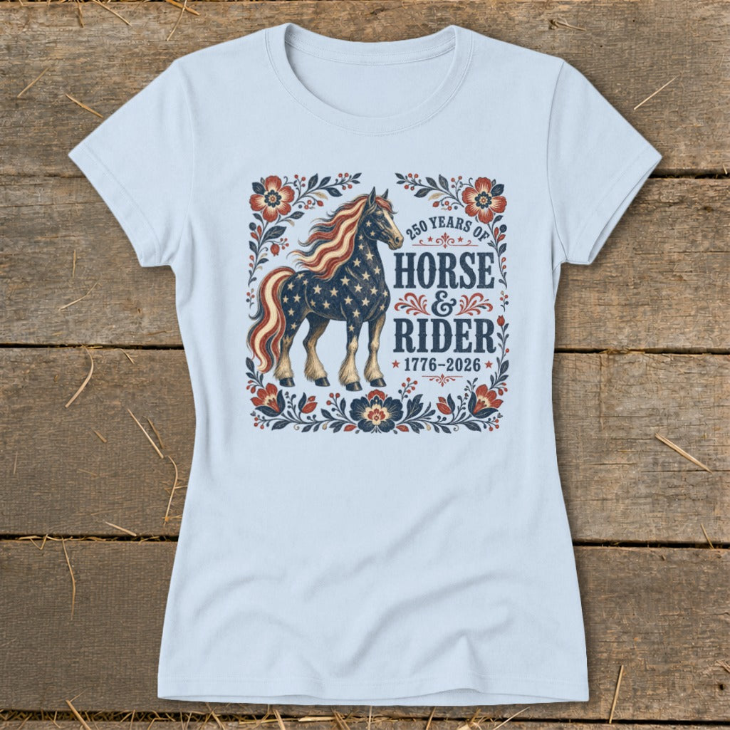 Light blue t-shirt with American flag horse graphic, text "250 Years of Horse & Rider 1776-2026".