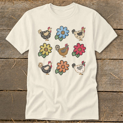 Cream t-shirt with nine watercolor drawings of chickens and flowers in a grid.