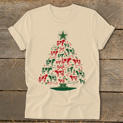 T-shirt with a Christmas tree shape made of red and green cows and holly.